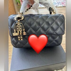Black Quilted Shoulder Bag with Gold Accents